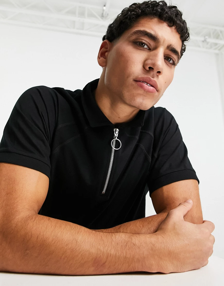 ASOS DESIGN – Polohemd in Schwarz mit Raglanärmeln und Reißverschluss günstig online kaufen