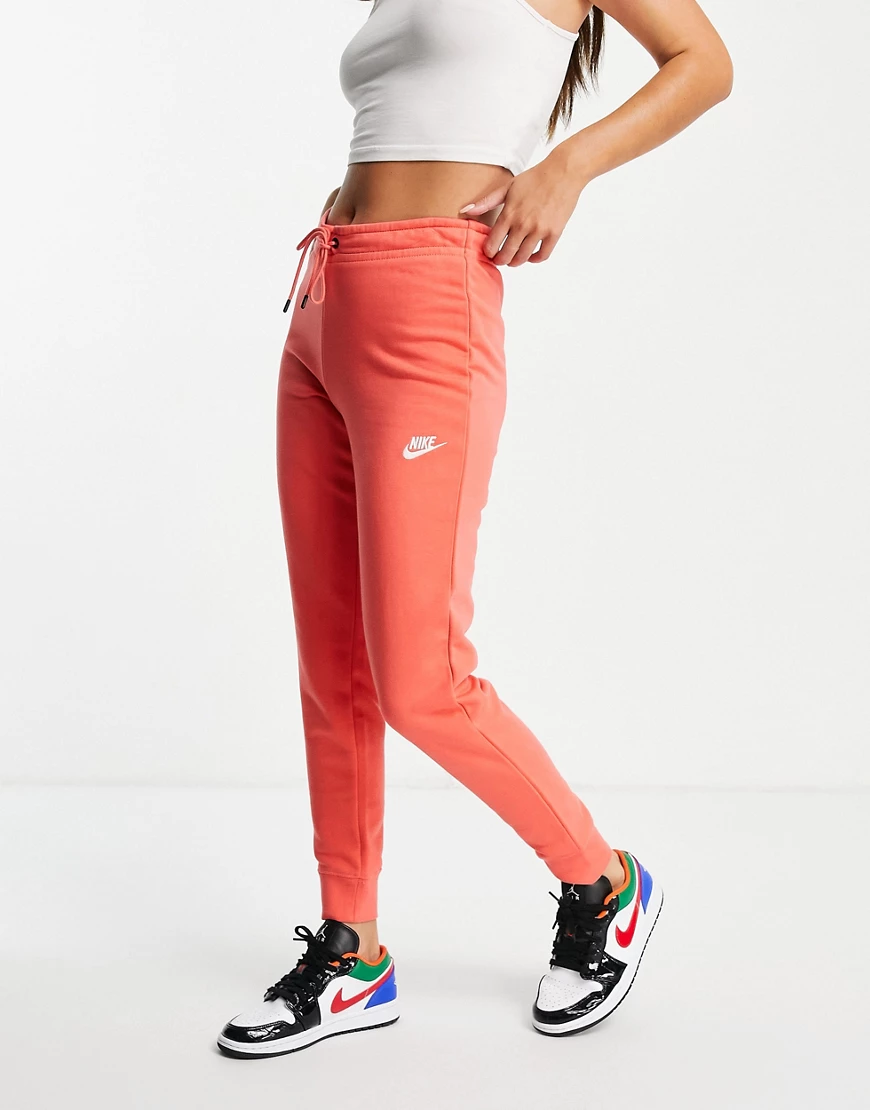 Nike – Essential – Enge Jogginghose aus Fleece in Korallenrosa günstig online kaufen