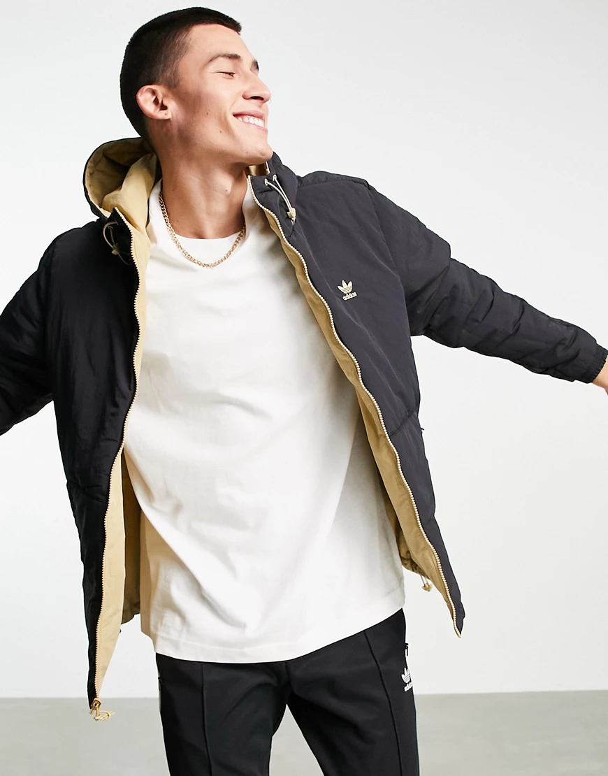 adidas Originals – Wendbare Jacke in Schwarz und Beige mit Streifen günstig online kaufen