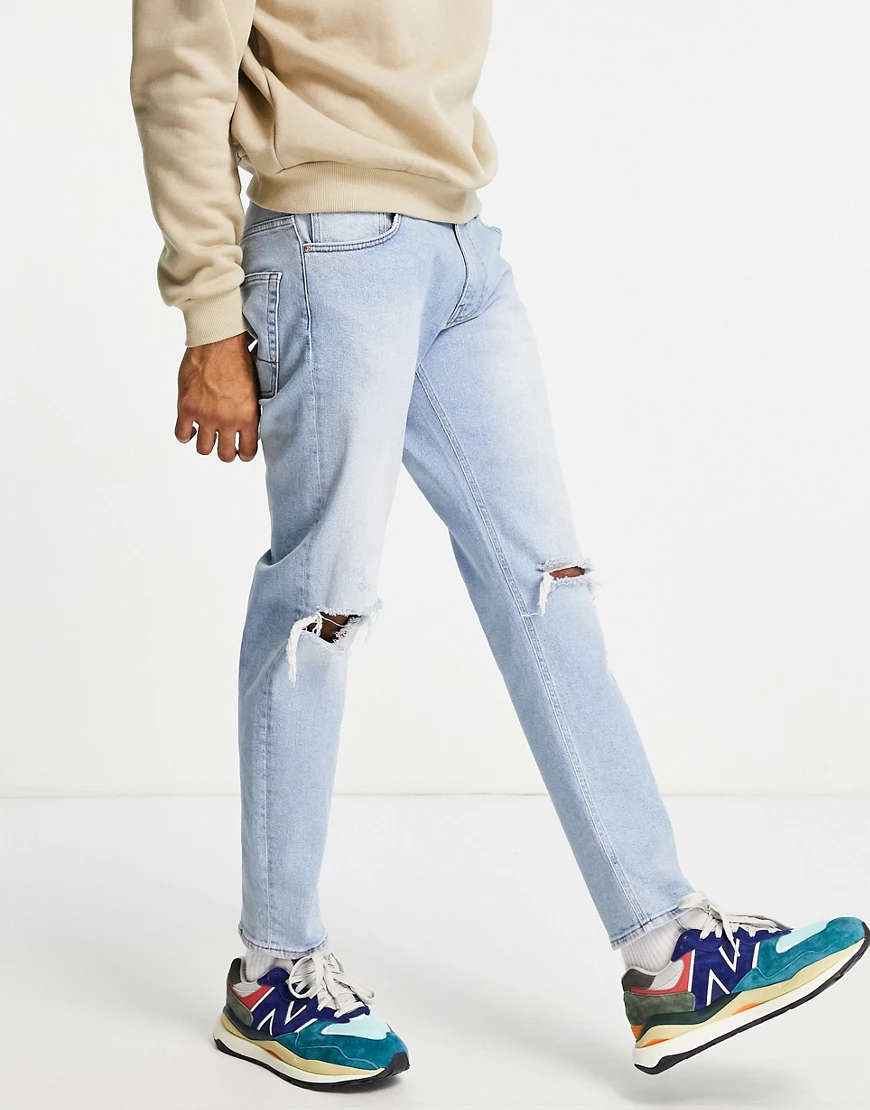 ASOS DESIGN – Karottenjeans in verwaschenem Vintage-Hellblau mit Stretch & günstig online kaufen