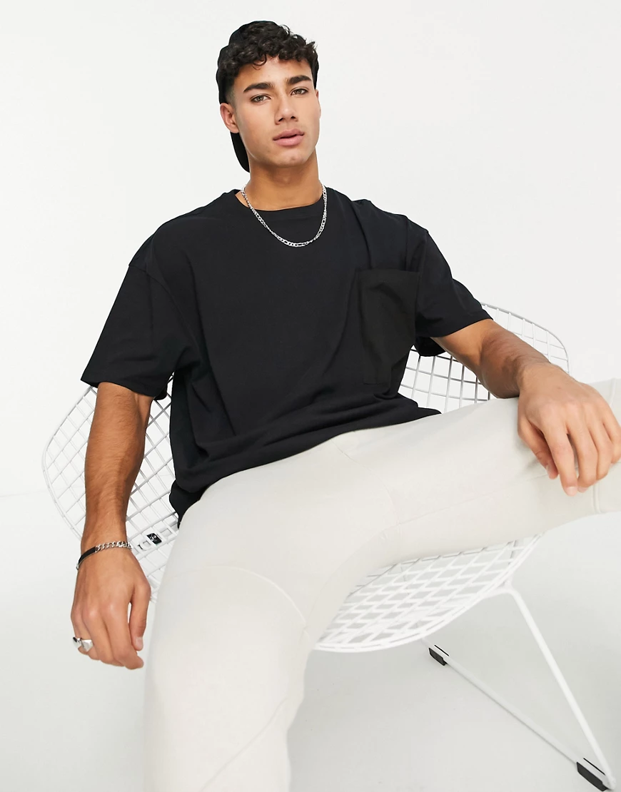 Threadbare – Oversize-T-Shirt in Schwarz mit übergroßen Taschen günstig online kaufen