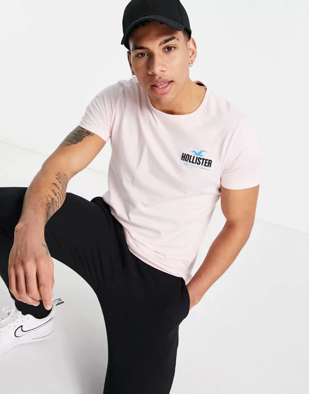 Hollister – Rosafarbenes T-Shirt mit Welt-Logoprint am Rücken günstig online kaufen