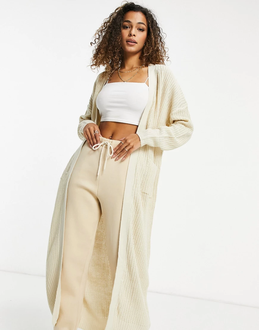 Missguided – Longline-Strickjacke mit Taschen in Creme-Weiß günstig online kaufen