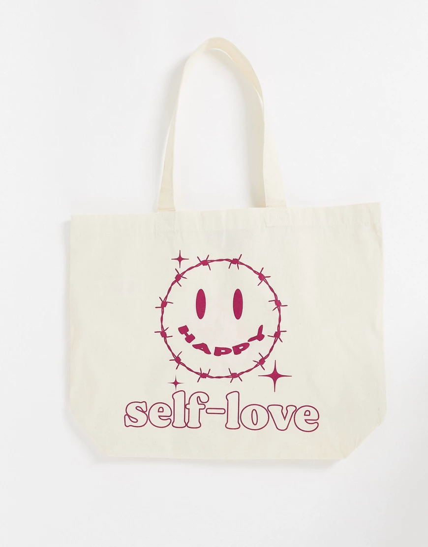 New Girl Order – Große Tragetasche in Cremeweiß mit „self-love“-Print günstig online kaufen