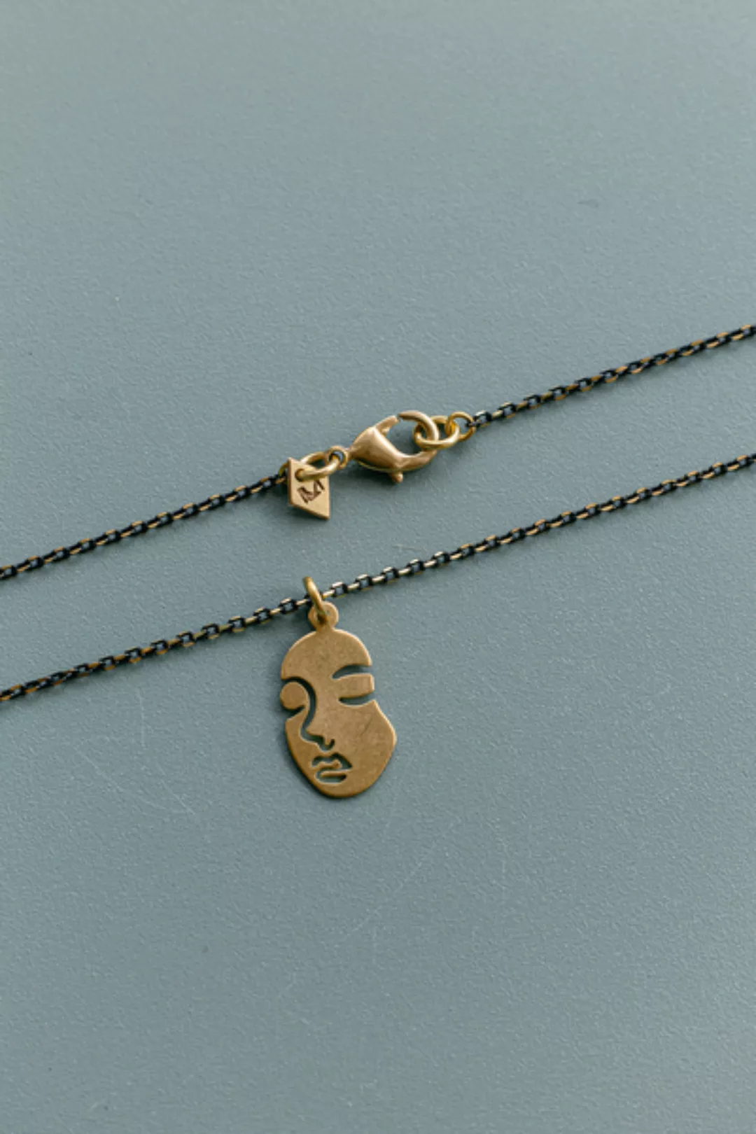 Halskette "Face " Messing In Gold Und Schwarz günstig online kaufen