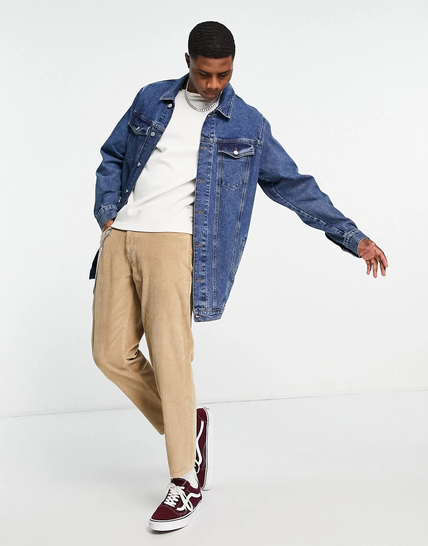 ASOS DESIGN – Longline-Jeansjacke im Stil der 70er-Jahre in mittelblauer Wa günstig online kaufen