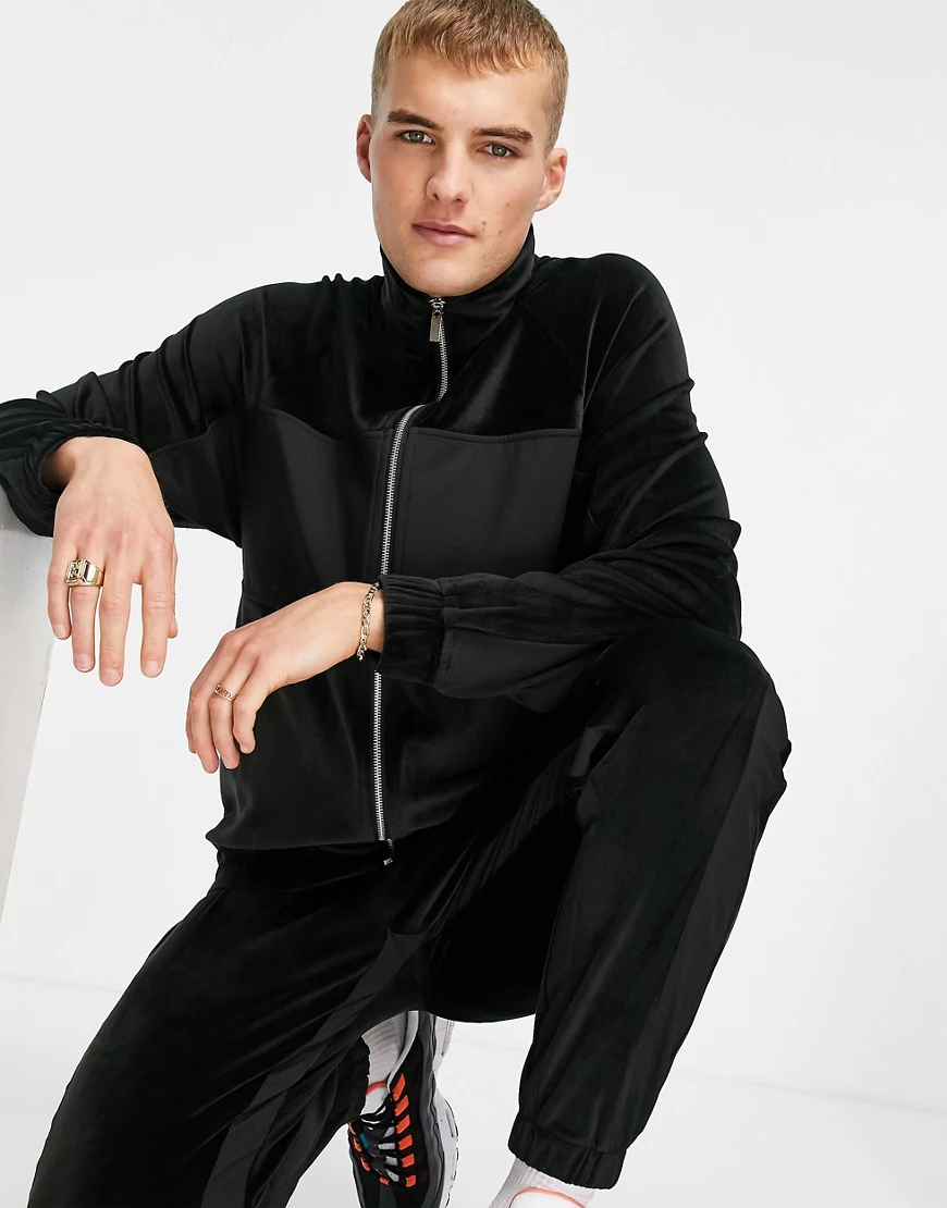 Topman – Trainingsjacke aus Velours in Schwarz mit Blockfarbendesign, Reißv günstig online kaufen