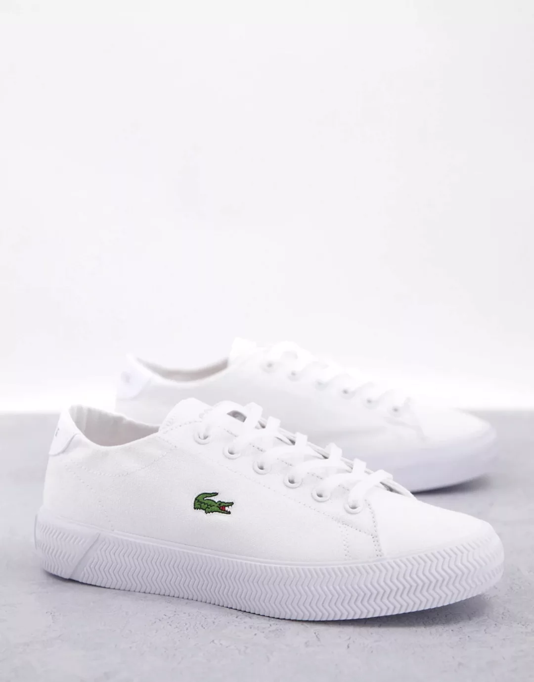 Lacoste – Gripshot – Flache Sneaker aus Leder in Weiß und Rosa günstig online kaufen