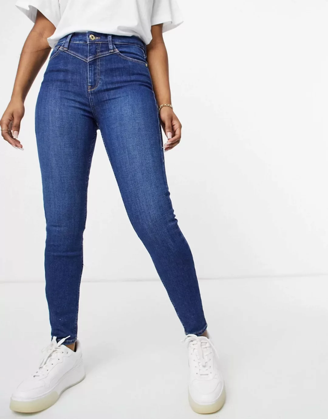 River Island – Enge Jeans mit hohem Bund und Passe in Mittelblau günstig online kaufen