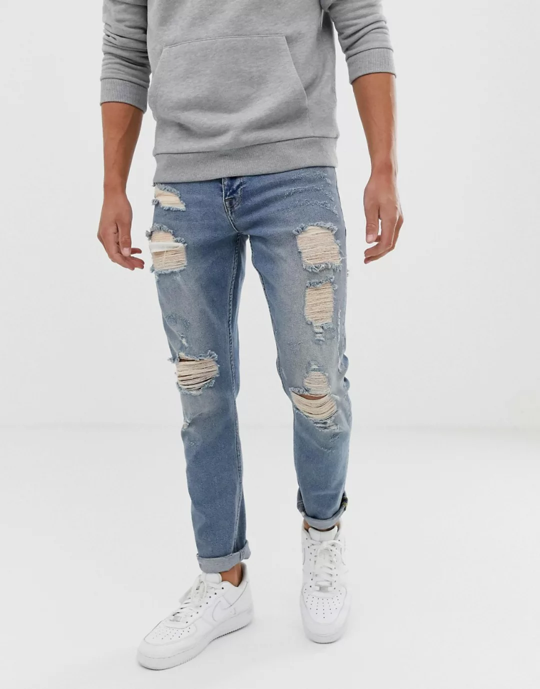 ASOS DESIGN – Schmale Stretch-Jeans mit großen Rissen in hellblauer Vintage günstig online kaufen