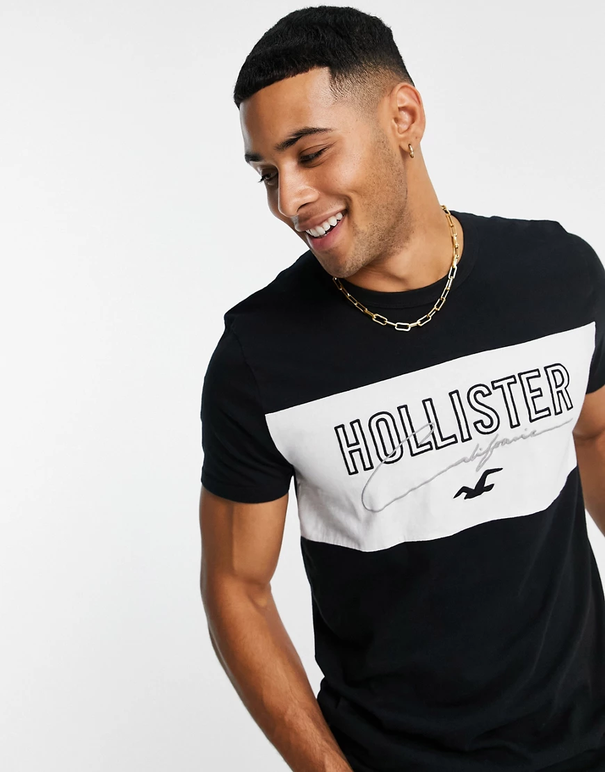Hollister – T-Shirt mit Farbblock-Design in Schwarz und Logo günstig online kaufen