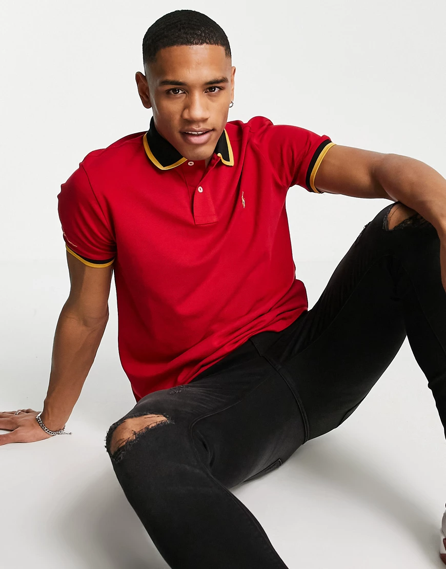 Polo Ralph Lauren – Polohemd aus Pikee in Rot mit Kontraststreifen und gold günstig online kaufen