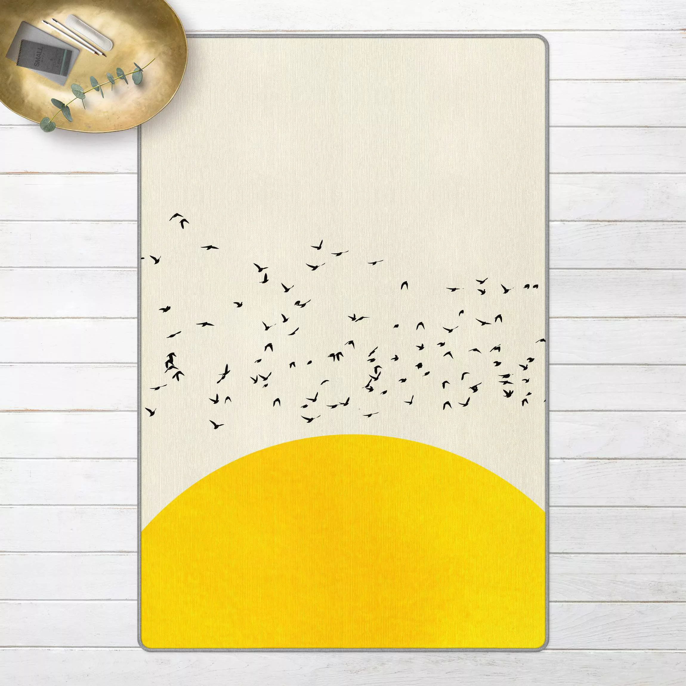 Teppich Vogelschwarm vor gelber Sonne günstig online kaufen