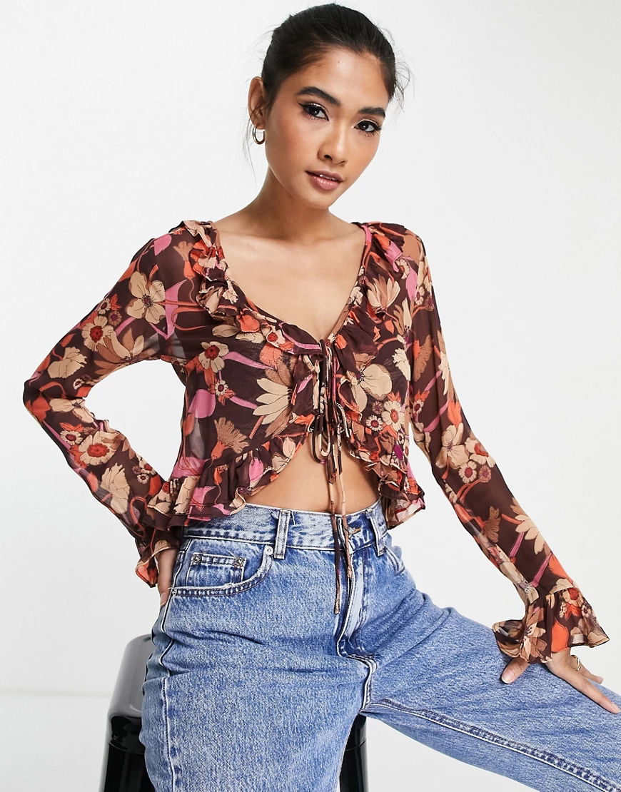 ASOS DESIGN – Geraffte Bluse mit transparentem Blumenmuster und Bindedetail günstig online kaufen