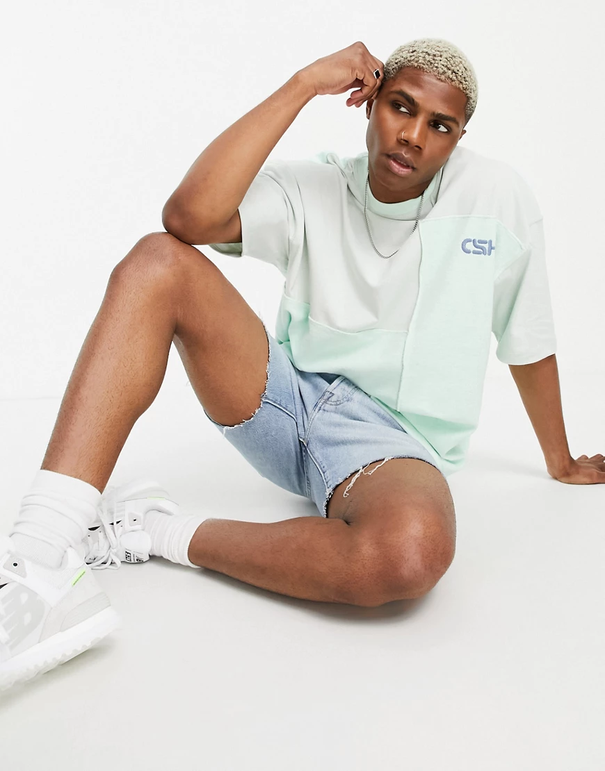 ASOS DESIGN – Oversize-T-Shirt aus Frottee mit Farbblockdesign in Grün-Mehr günstig online kaufen