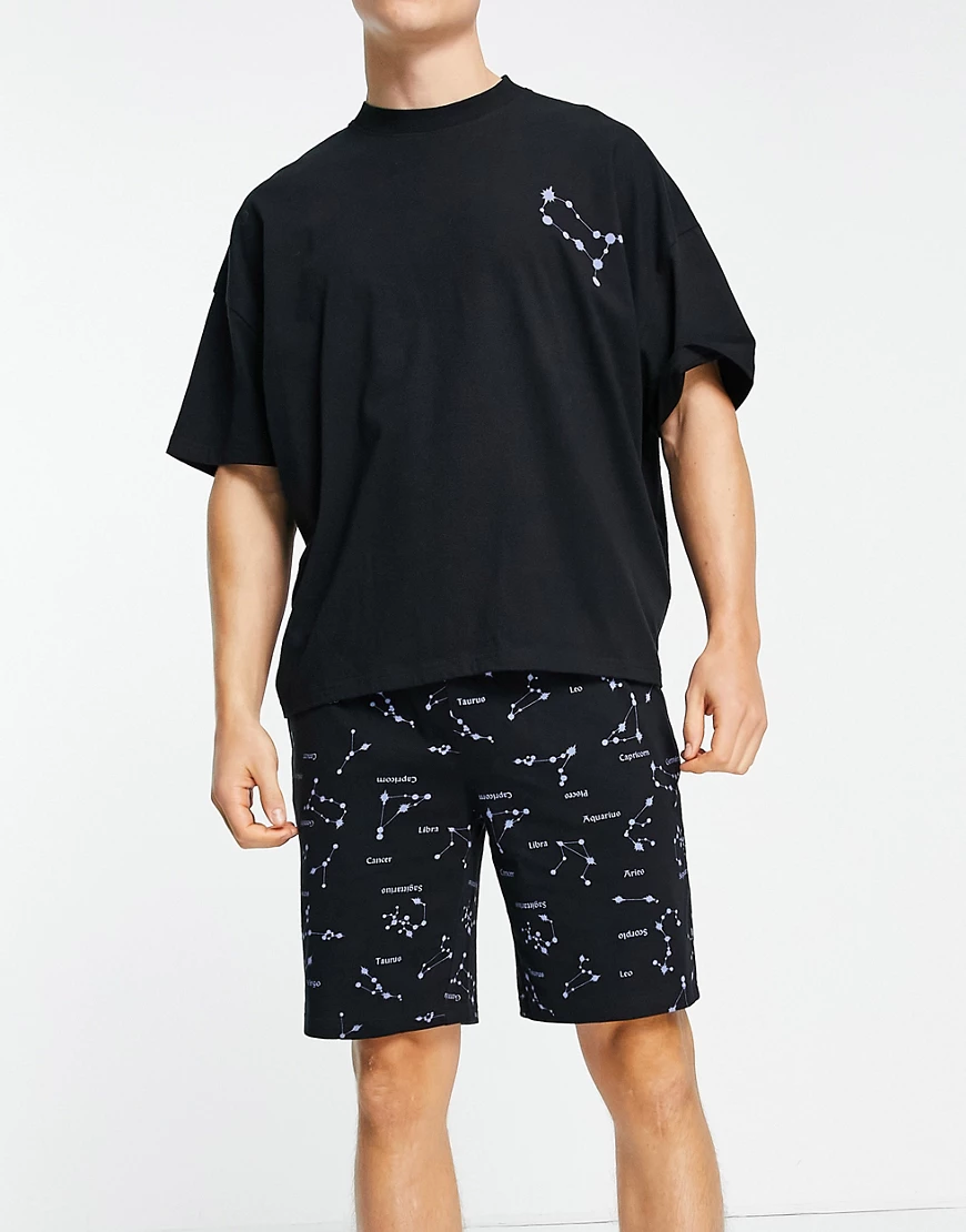 ASOS DESIGN – Lounge-Pyjamaset in Schwarz mit T-Shirt und Shorts mit Sternz günstig online kaufen