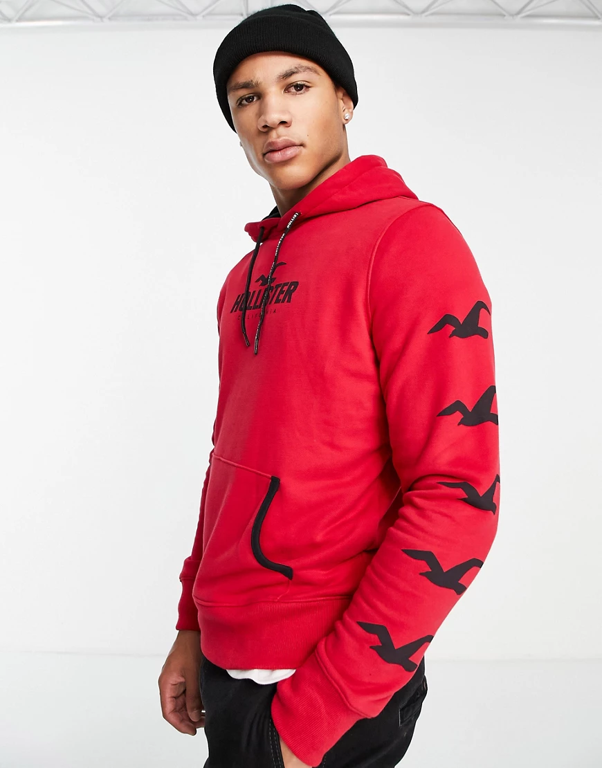 Hollister – Sport – Kapuzenpullover in Rot mit Logoprint auf den Ärmeln günstig online kaufen