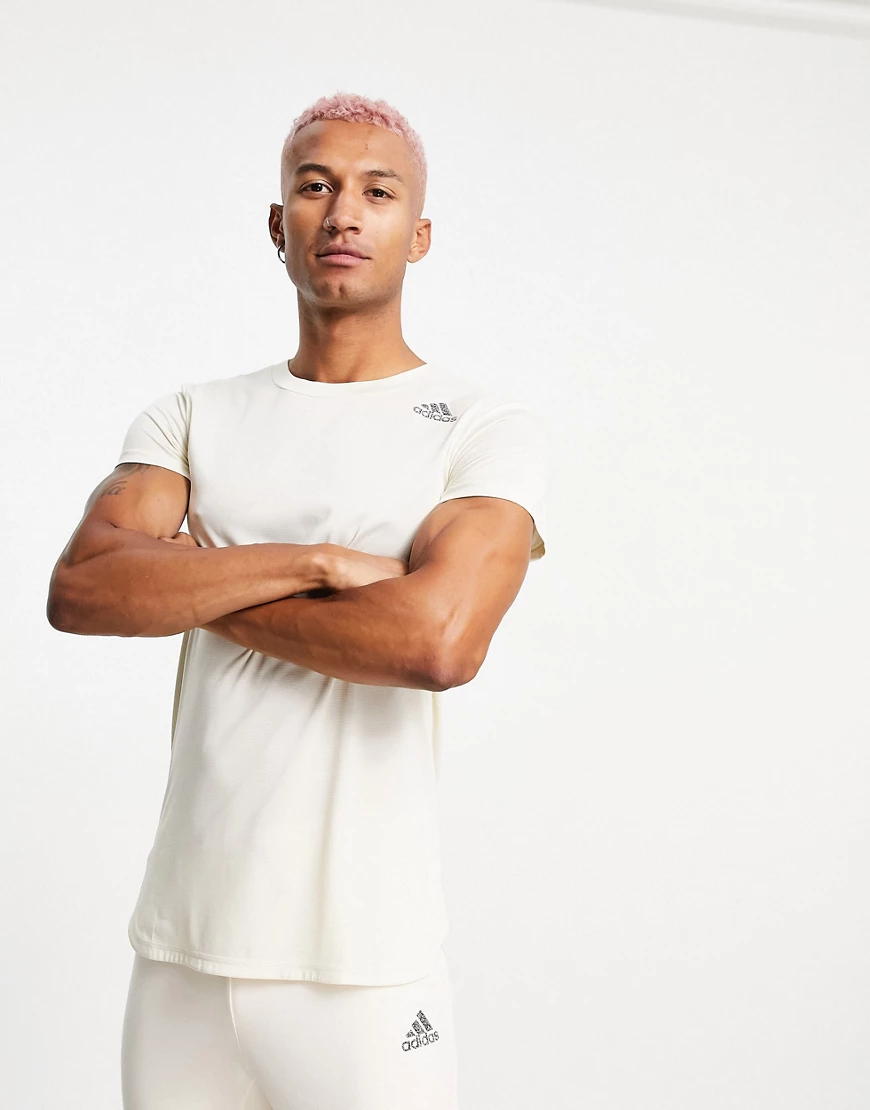 adidas – Yoga – T-Shirt in Beige mit drei farblich abgestimmten Streifen hi günstig online kaufen