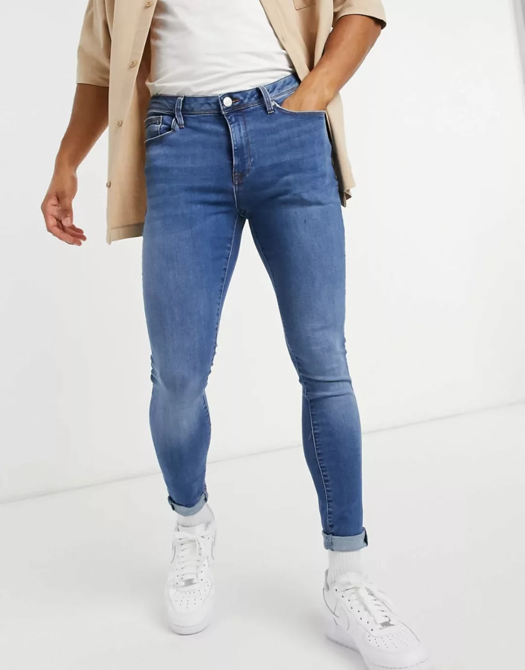 River Island – Spray-On-Jeans mit engem Schnitt in mittelblauer Waschung günstig online kaufen