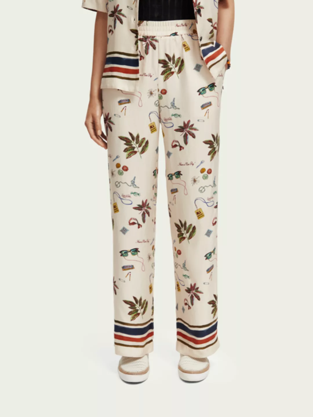 The Gia mid-rise wide-leg printed trousers günstig online kaufen