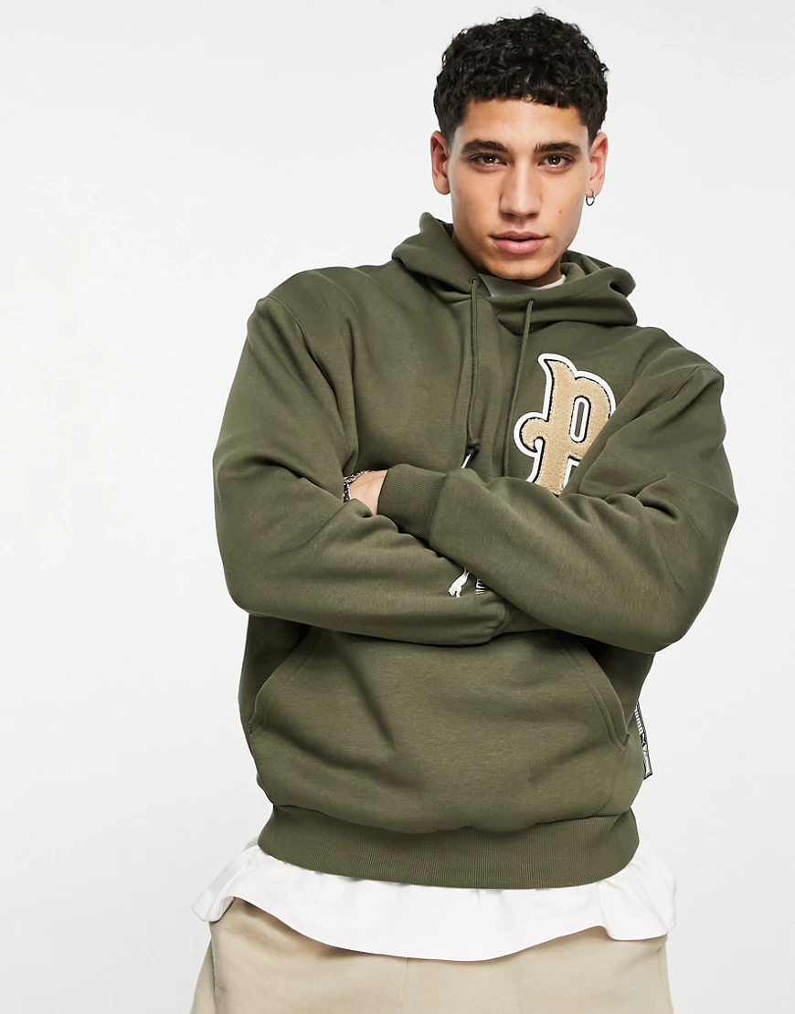 PUMA – Team – Kapuzenpullover in Khaki-Grün günstig online kaufen