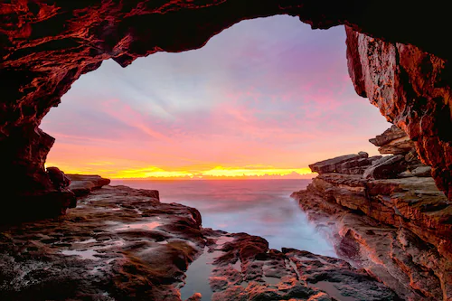 Papermoon Fototapete »GROTTE-FELSEN HÖHLE SONNENAUFGANG KÜSTE OZEAN MEER« günstig online kaufen