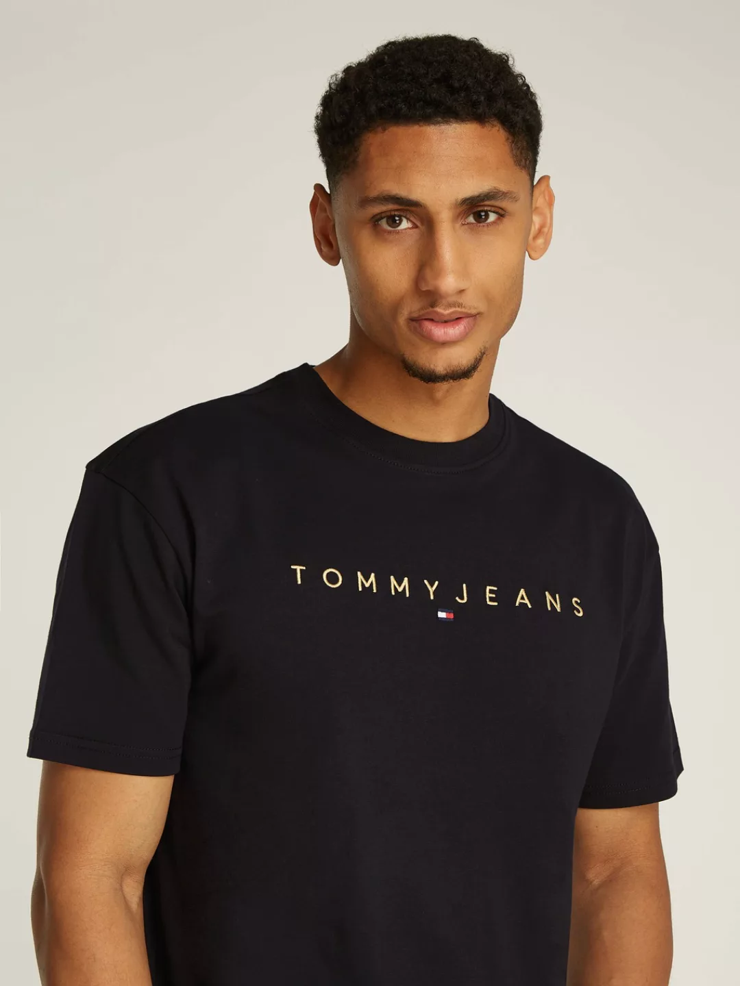 Tommy Jeans T-Shirt TJM REG GOLD LINEAR LOGO TEE EXT günstig online kaufen