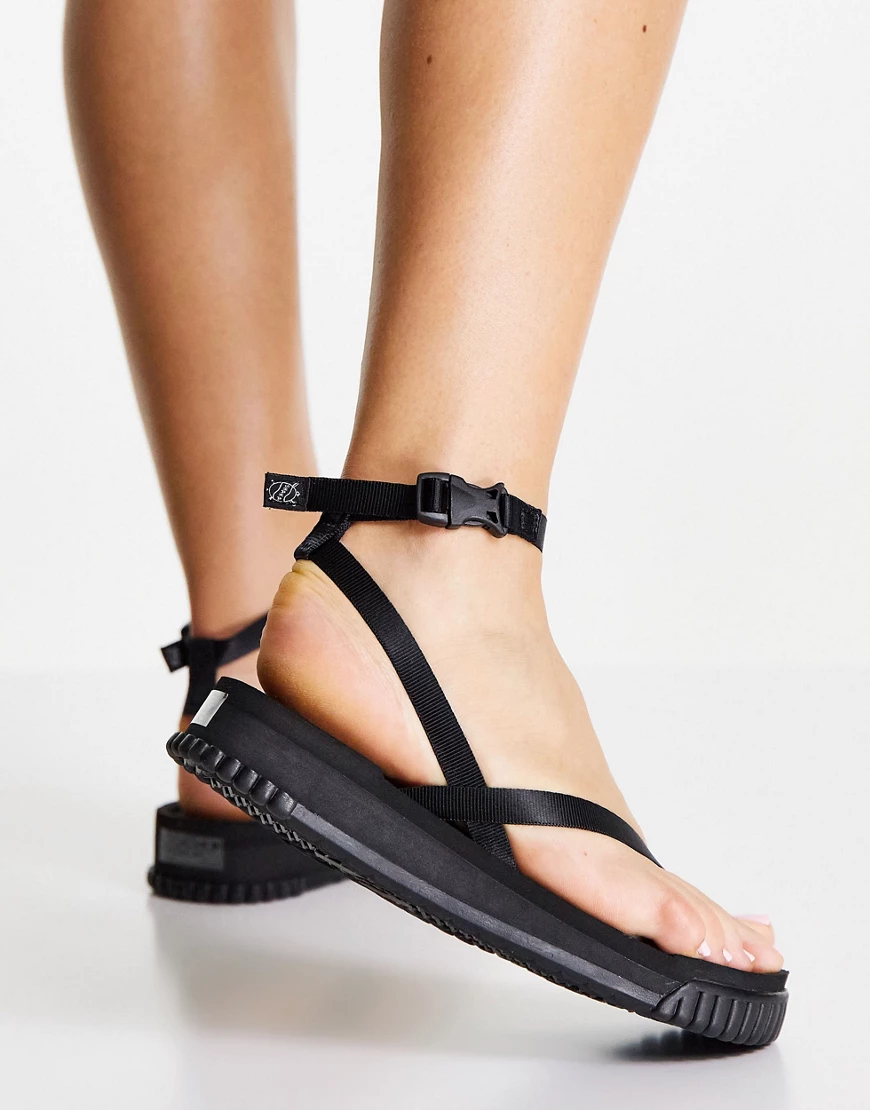 Shaka – Buena Vista – Flache Sandalen in Schwarz mit überkreuzten Riemen günstig online kaufen