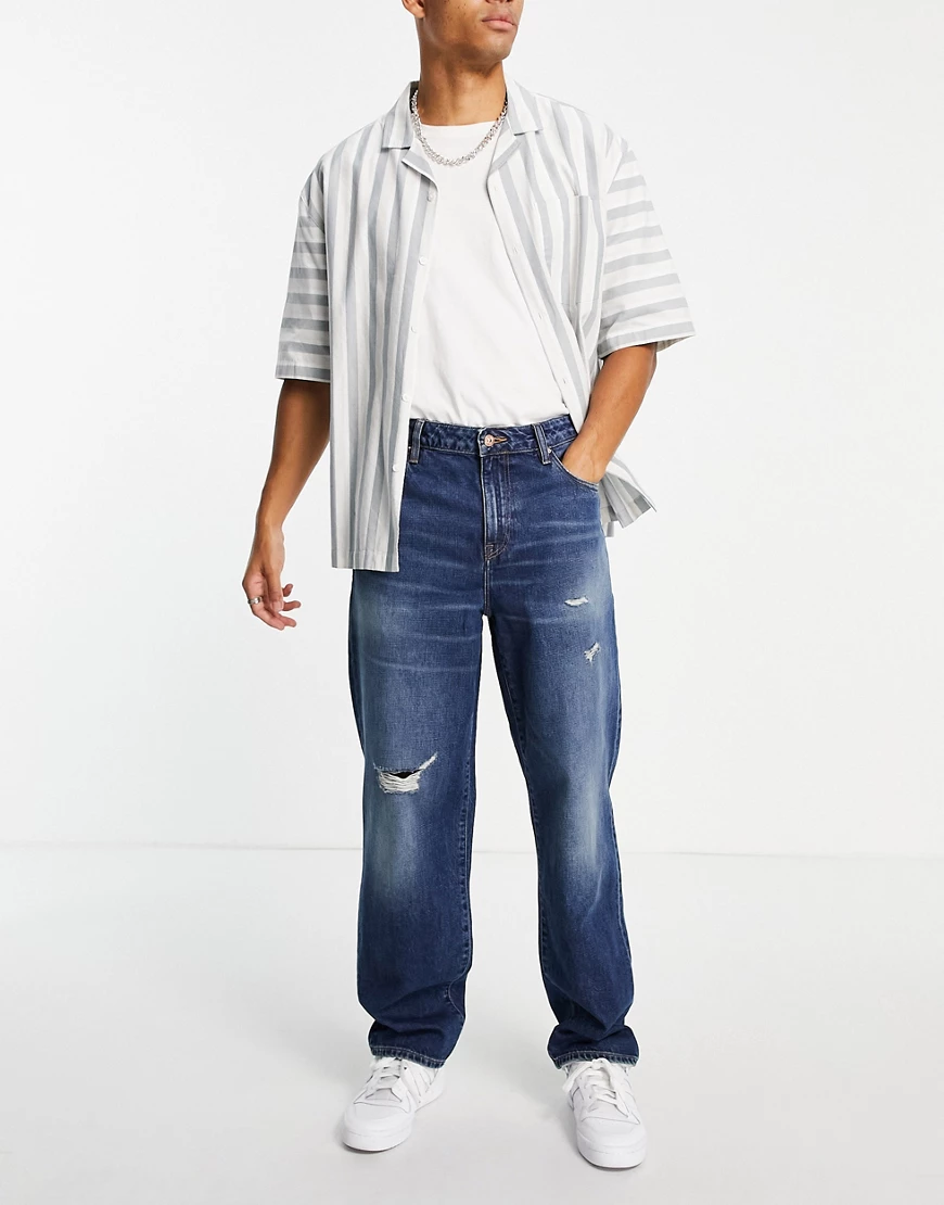 ASOS DESIGN – Weite Jeans mit dunkler „Less Thirsty“-Waschung und Abnutzung günstig online kaufen