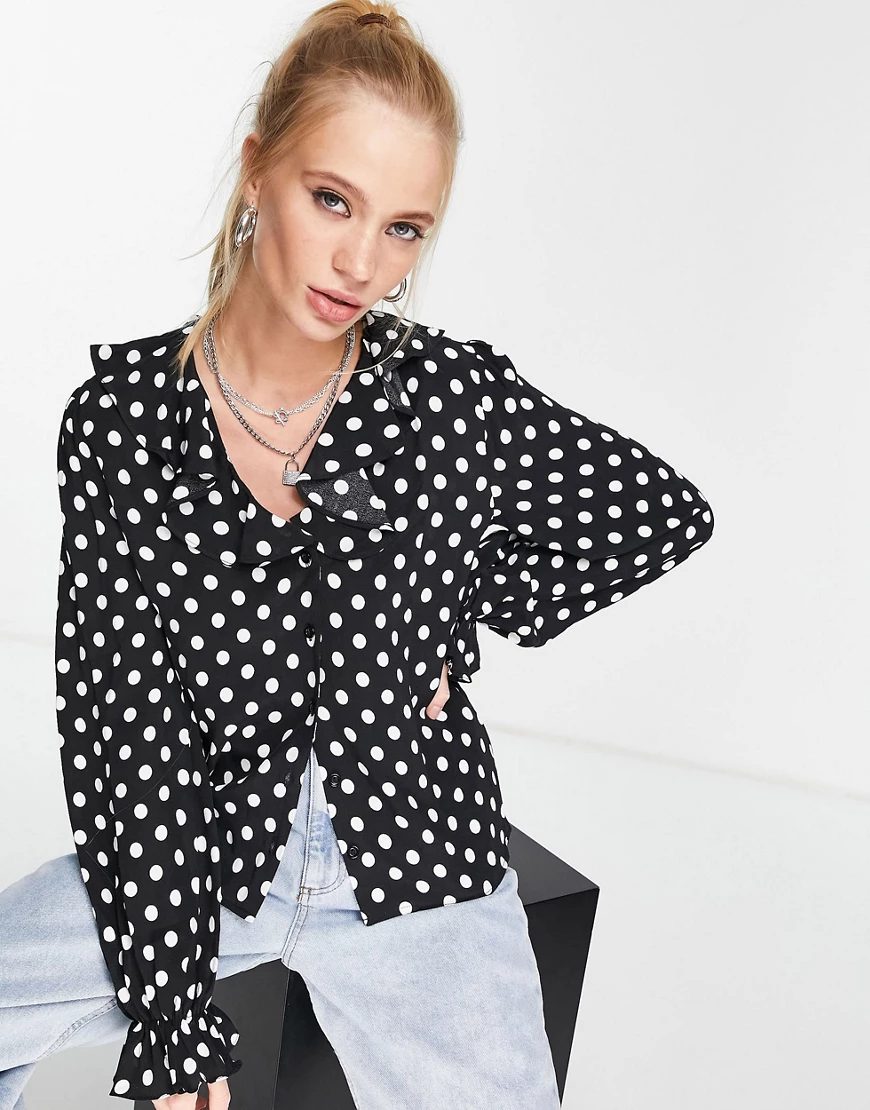 Topshop – Gepunktete Bluse in Schwarz-Weiß mit Rüschen günstig online kaufen
