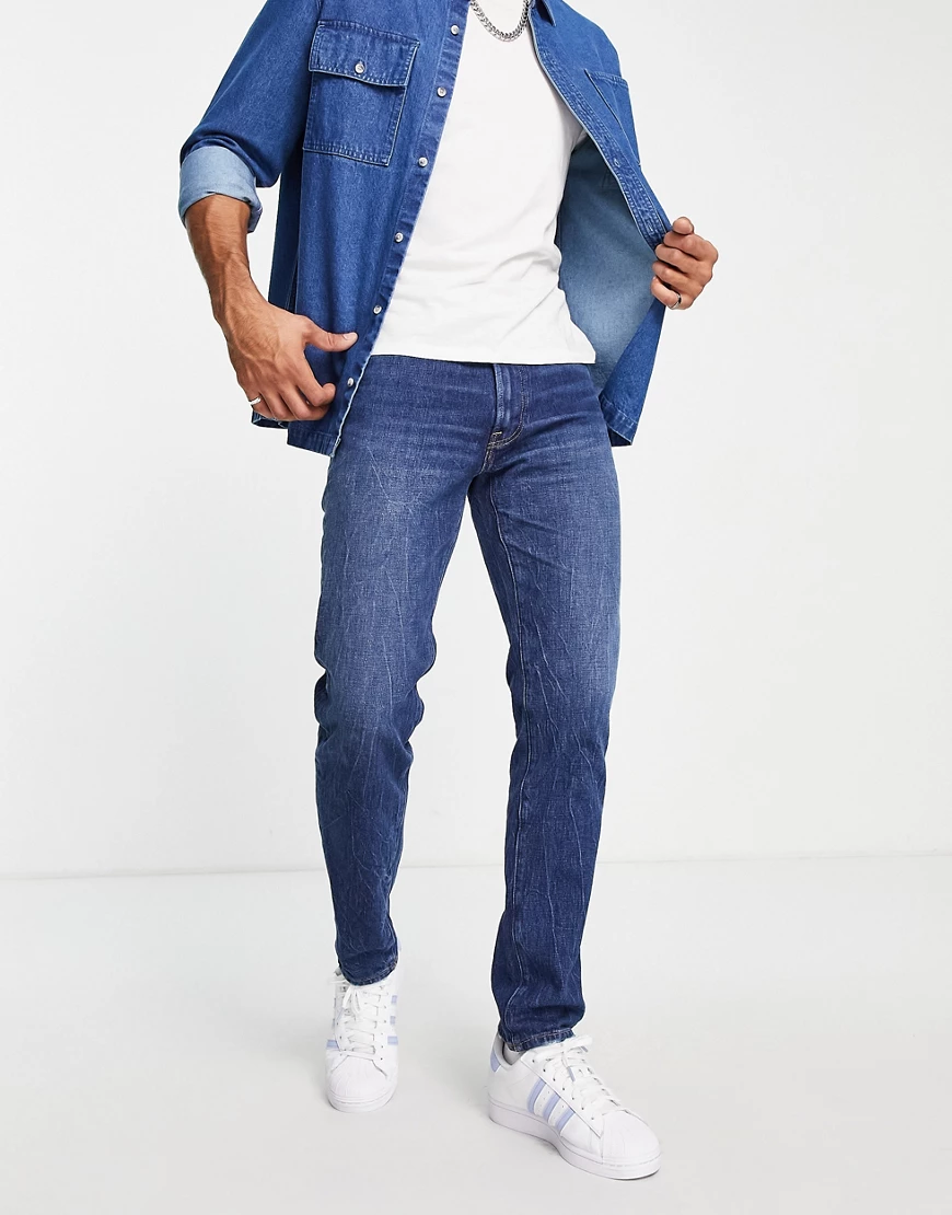 Abercrombie & Fitch – Schmale Jeans in dunkler Waschung im Stil der 90er-Bl günstig online kaufen