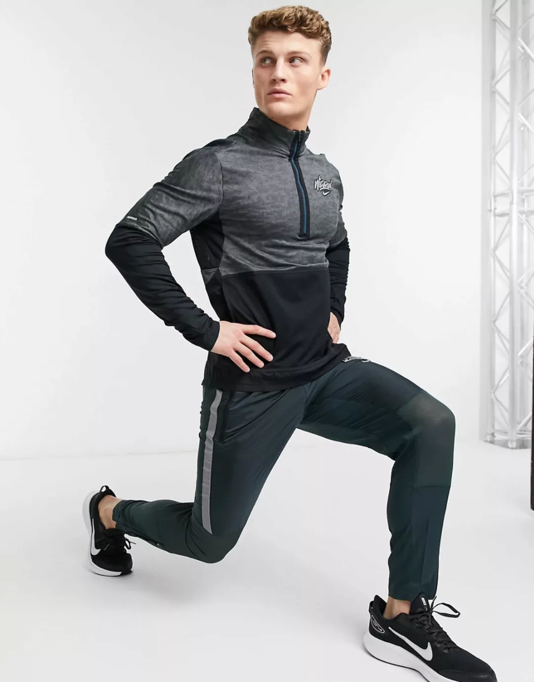 Nike Running – Wild Run Element – Oberteil mit 1/4-Reißverschluss in Schwar günstig online kaufen