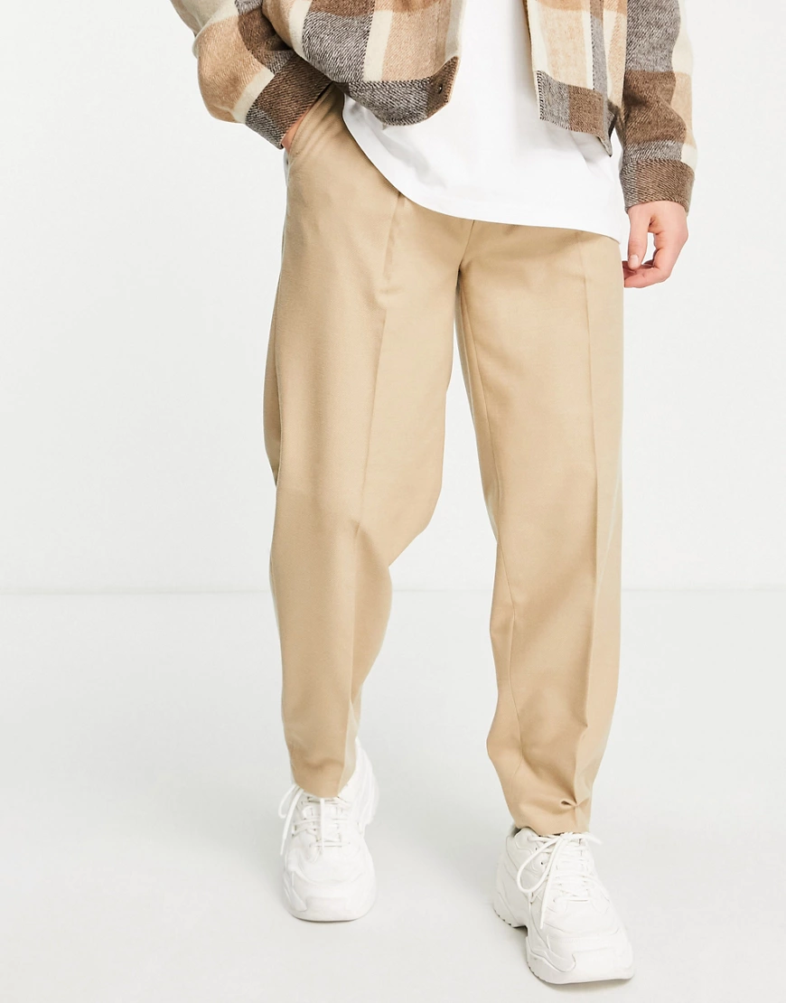 ASOS DESIGN – Schmal zulaufende Oversized-Hose in Steinbraun-Neutral günstig online kaufen