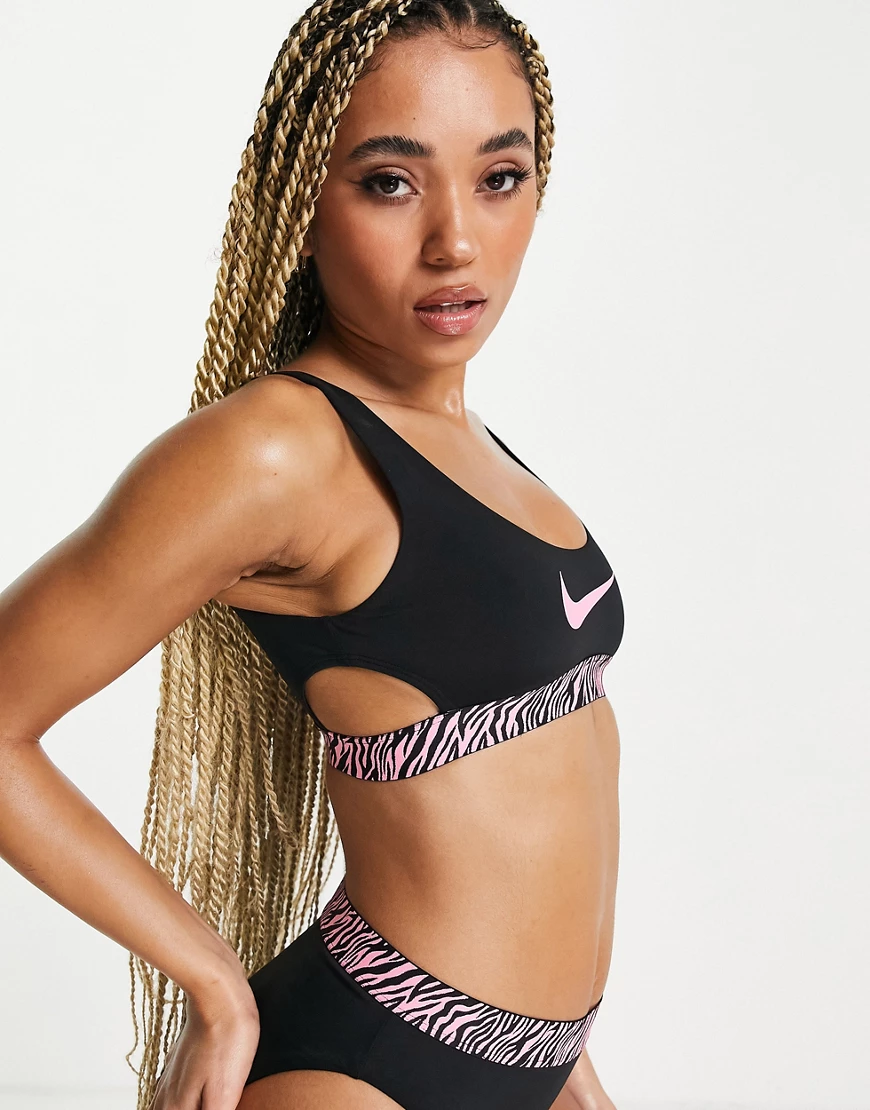Nike Swimming – Bikini-Oberteil in Schwarz mit Zierstreifen mit Animal-Prin günstig online kaufen