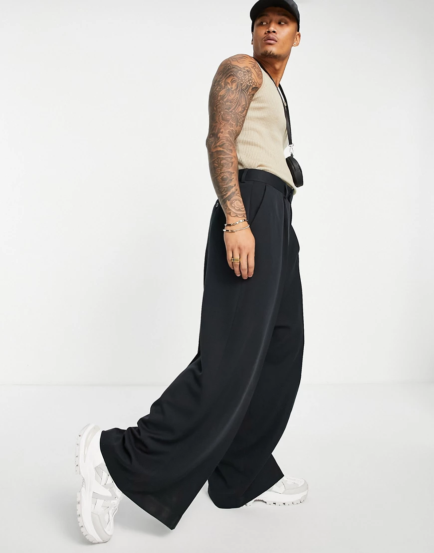 ASOS DESIGN – Elegante, extrem weit geschnittene Hose in Schwarz günstig online kaufen