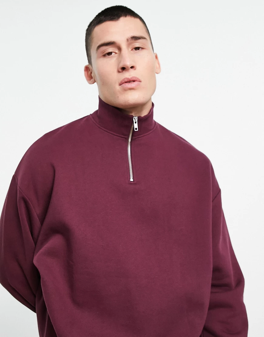 ASOS DESIGN – Oversize-Sweatshirt mit kurzem Reißverschluss in Rot günstig online kaufen