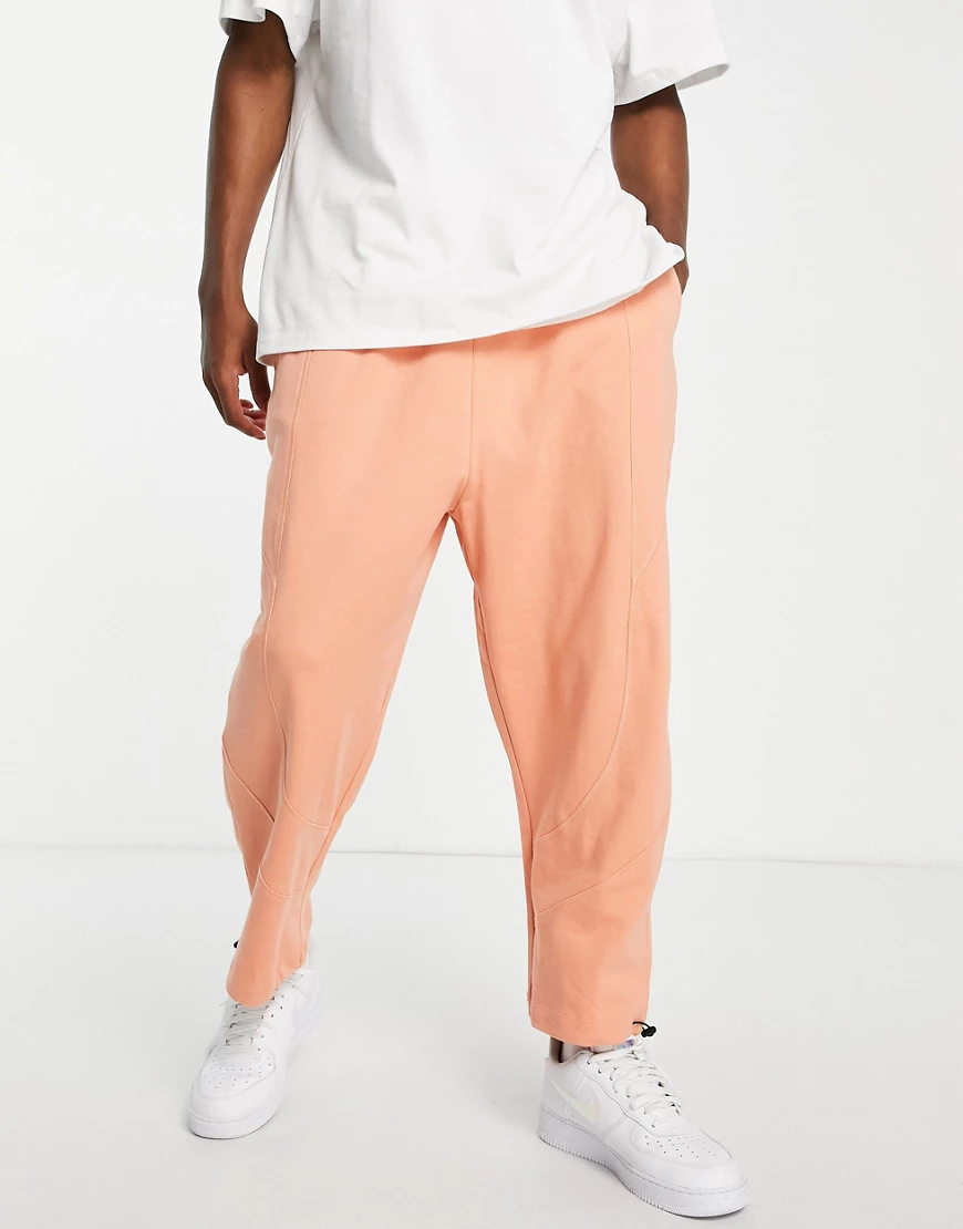 ASOS DESIGN – Oversize-Jogginghose mit Einsatzdetail in Pastellorange günstig online kaufen