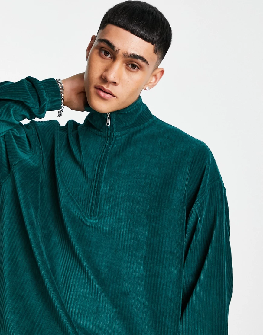 ASOS DESIGN – Oversize-Sweatshirt aus geripptem Velours in Tiefgrün mit kur günstig online kaufen