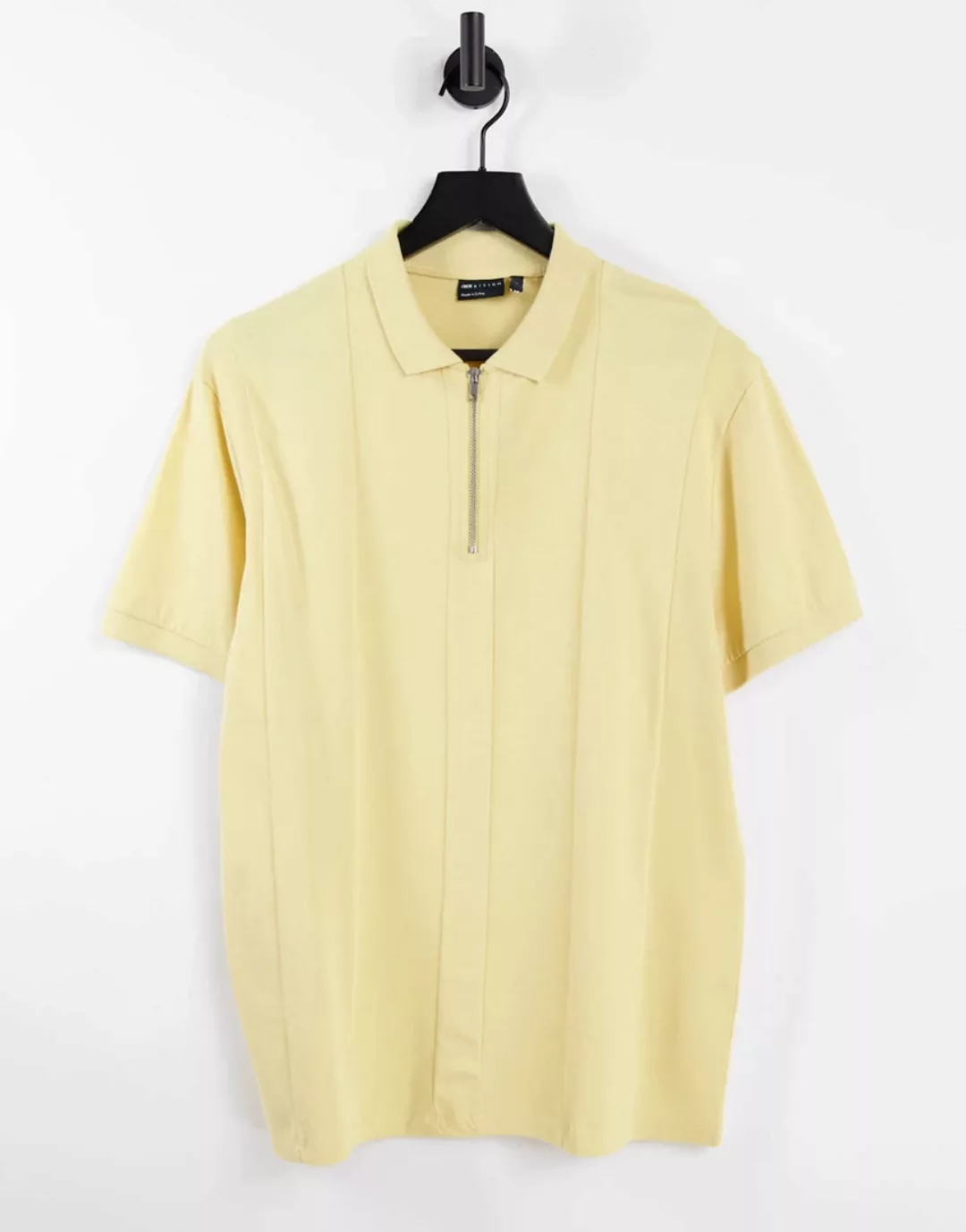 ASOS DESIGN – Pikee-Polohemd in verwaschenem Gelb mit Bahnendesign und Reiß günstig online kaufen