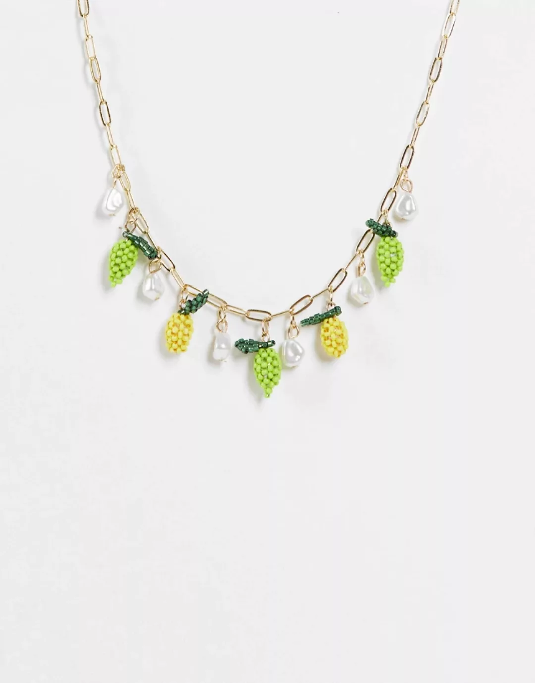 ASOS DESIGN – Goldfarbene Halskette, mit Kügelchen im Fruchtdesign und Kuns günstig online kaufen