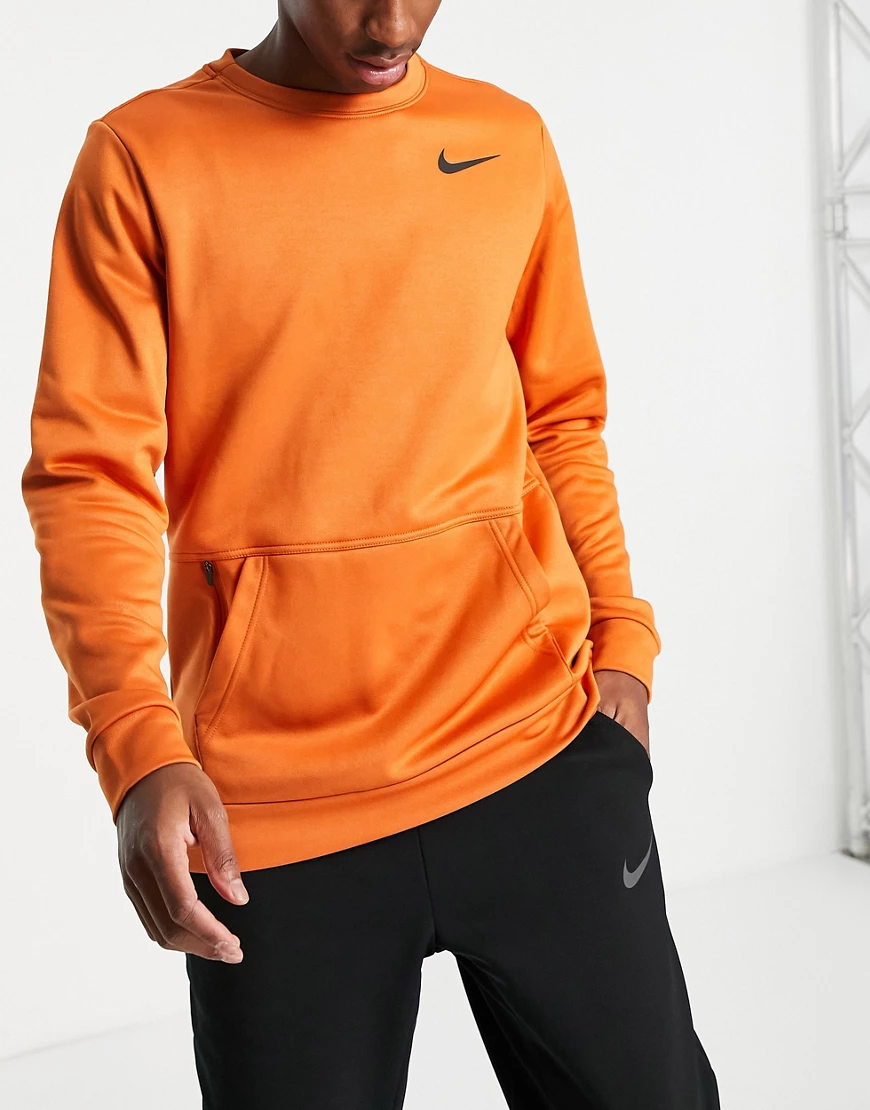 Nike Training – Therma-FIT – Sweatshirt in Orange mit Rundhalsausschnitt-Ro günstig online kaufen