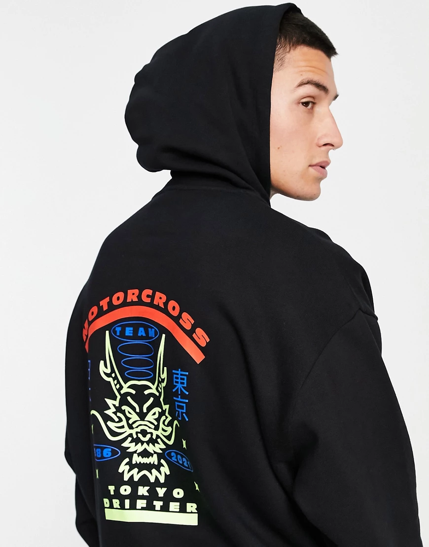 ASOS DESIGN – Oversize-Kapuzenpullover in Schwarz mit „Motocross“-Print hin günstig online kaufen