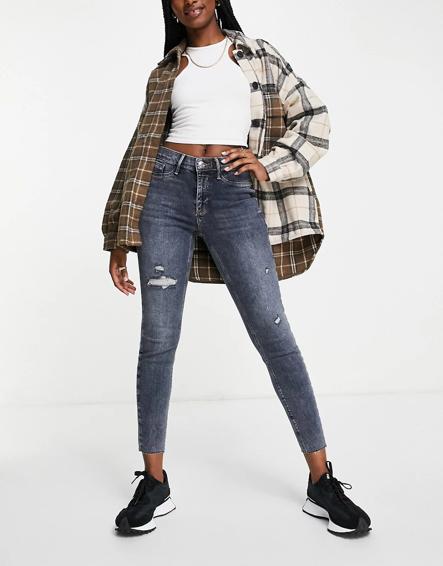 River Island – Molly – Eng geschnittene Jeans aus dunklem Denim mit mittelh günstig online kaufen