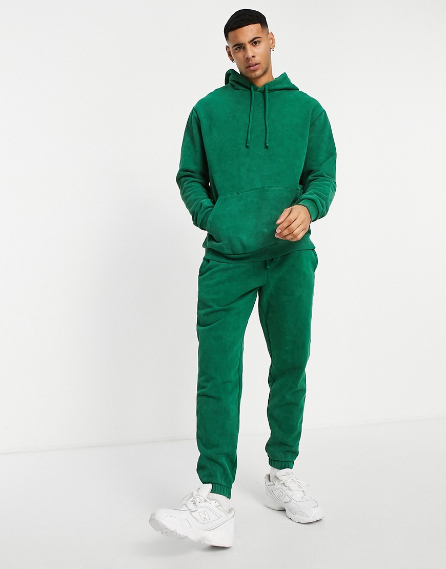 ASOS DESIGN – Schmal zulaufende Jogginghose in grüner Vintage-Waschung, Kom günstig online kaufen