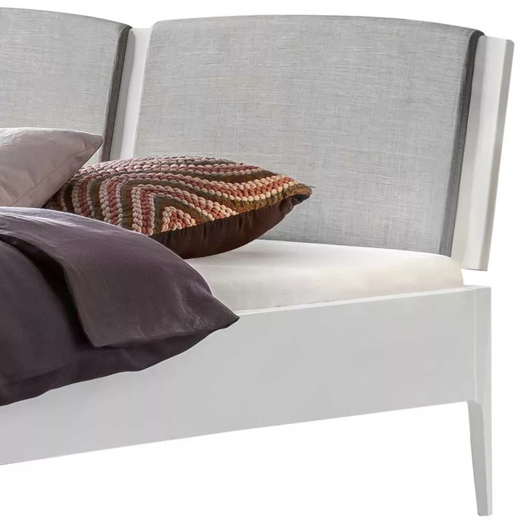 Massives Holzbett in Weiß aus Buche Massivholz mit Polsterkopfteil günstig online kaufen