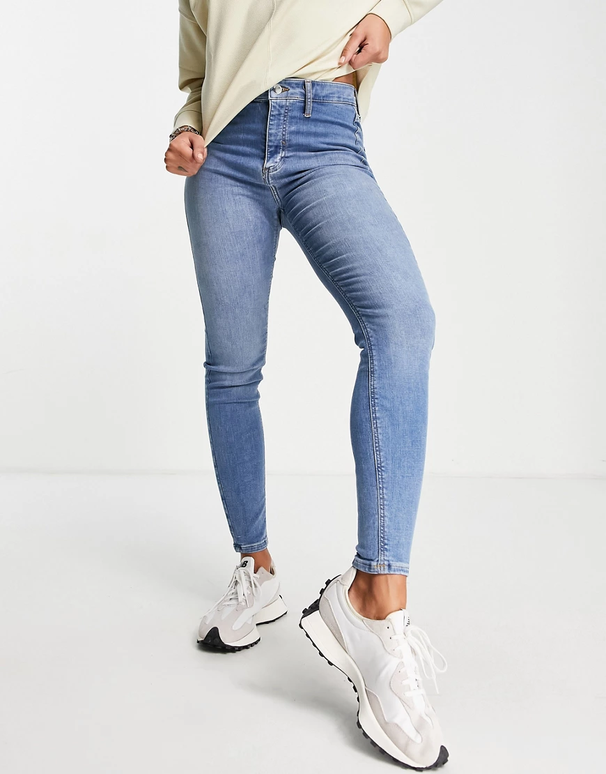 River Island – Kaia – Enge Jeans mit hohem Bund in Mittelblau-Grau günstig online kaufen