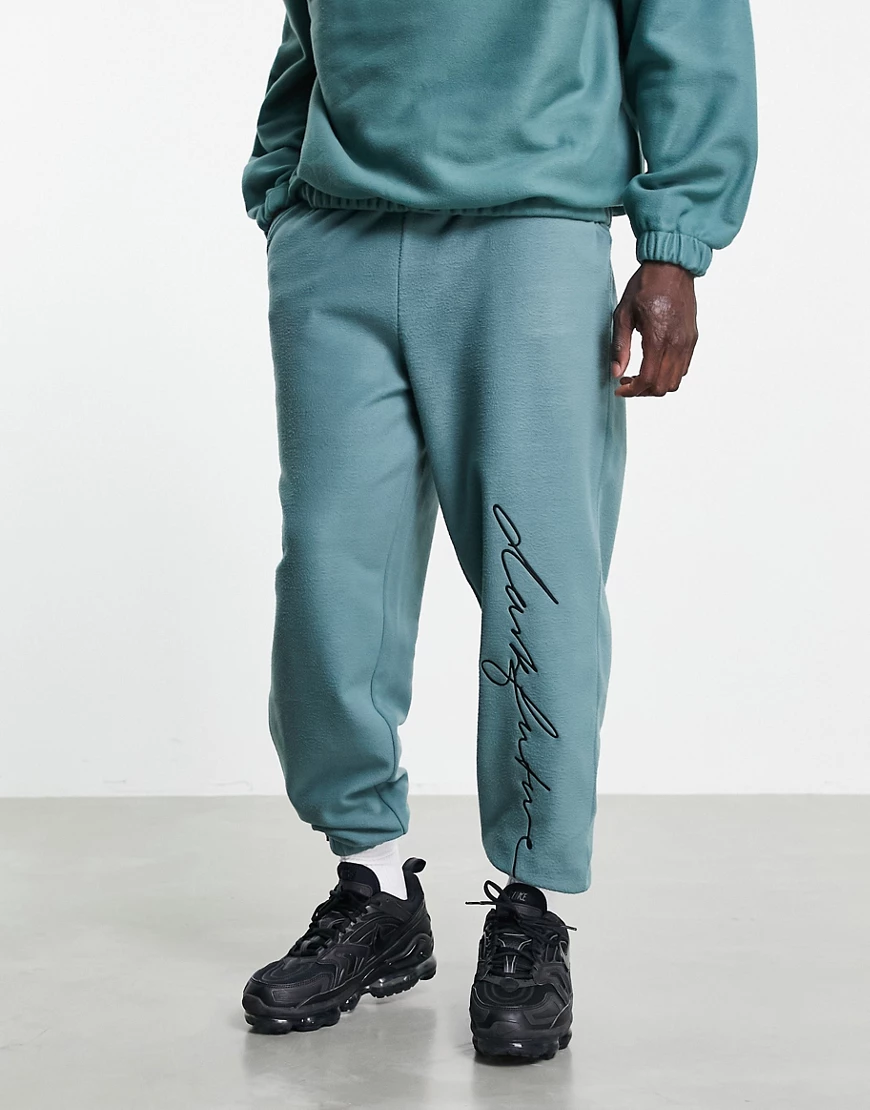ASOS – Dark Future – Locker geschnittene Jogginghose aus Polarfleece in Grü günstig online kaufen