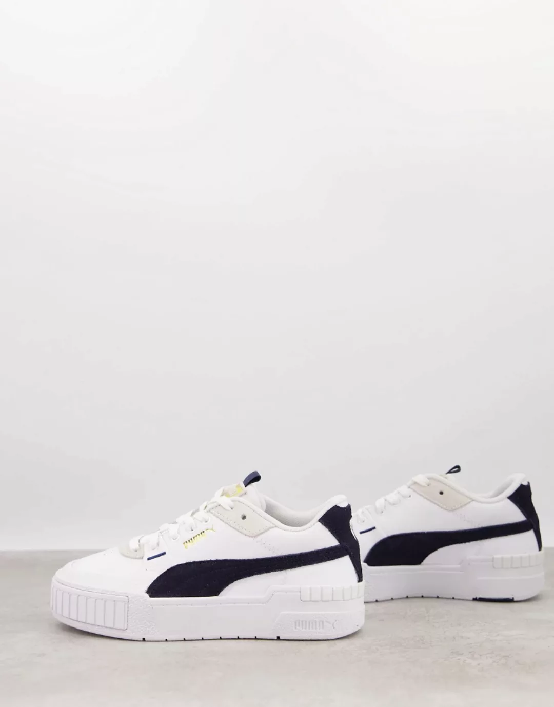 Puma – Cali Sport – Sneaker mit dicker Sohle in Marineblau-Weiß günstig online kaufen