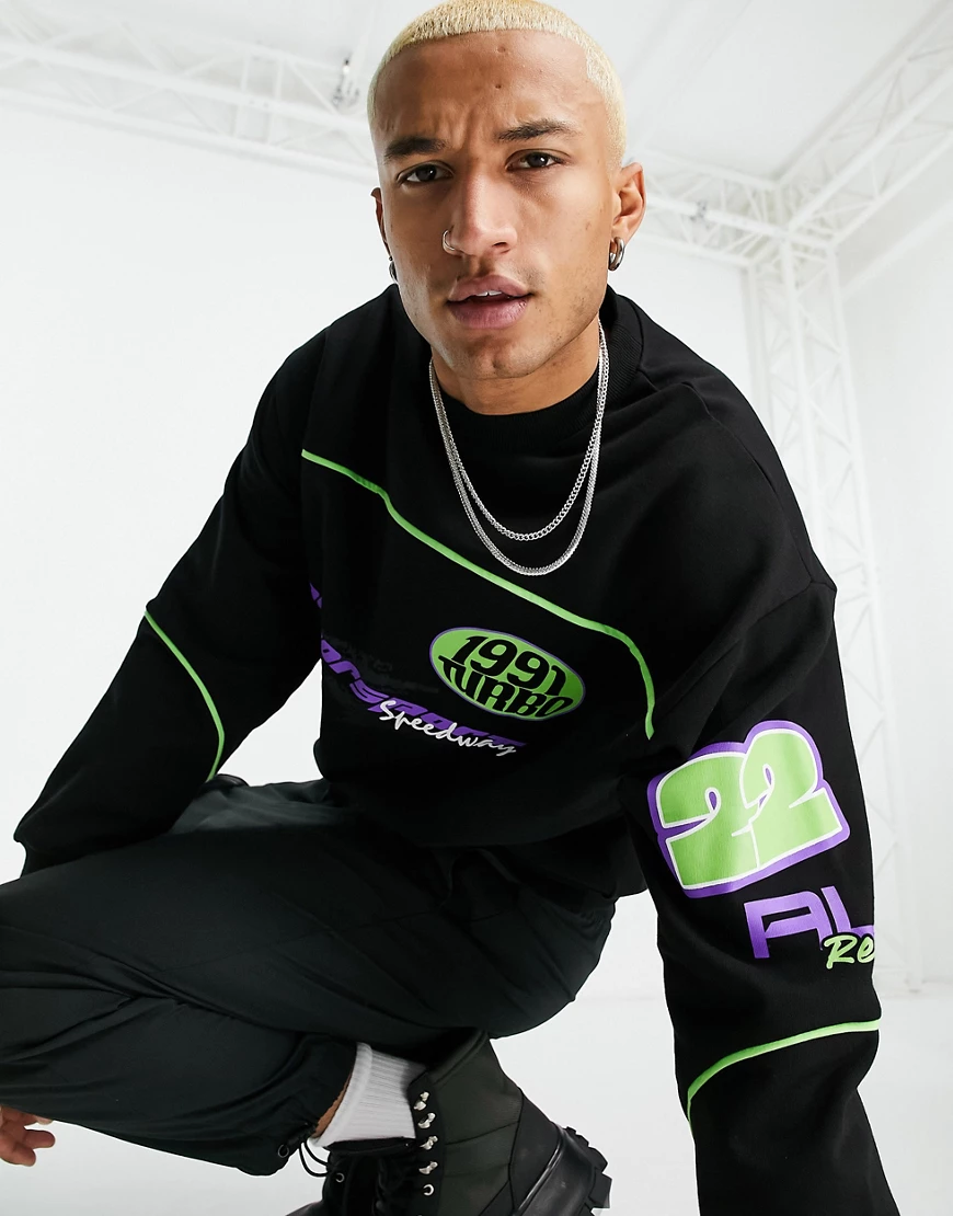 ASOS DESIGN – Oversize-Sweatshirt in Schwarz mit Zierstreifen und Motocross günstig online kaufen