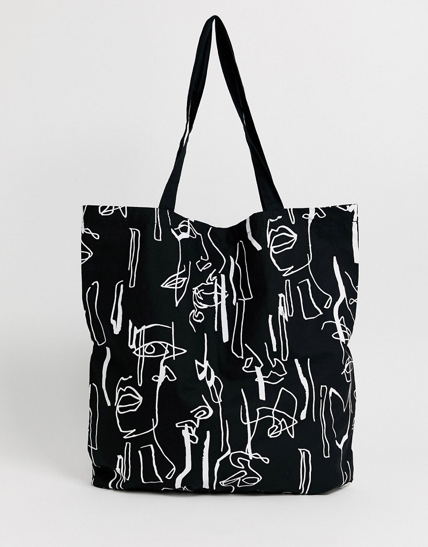 ASOS DESIGN – Große Shopper-Tasche aus Bio-Baumwolle mit abstraktem Gesicht günstig online kaufen